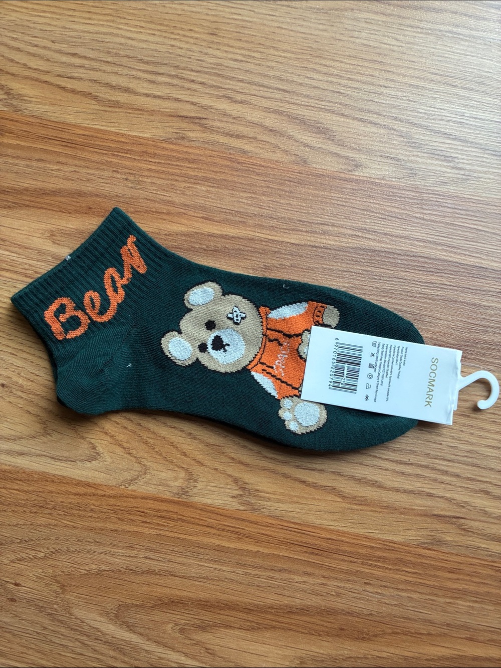 mark. Dark Green Socks with Orange Bear Accent